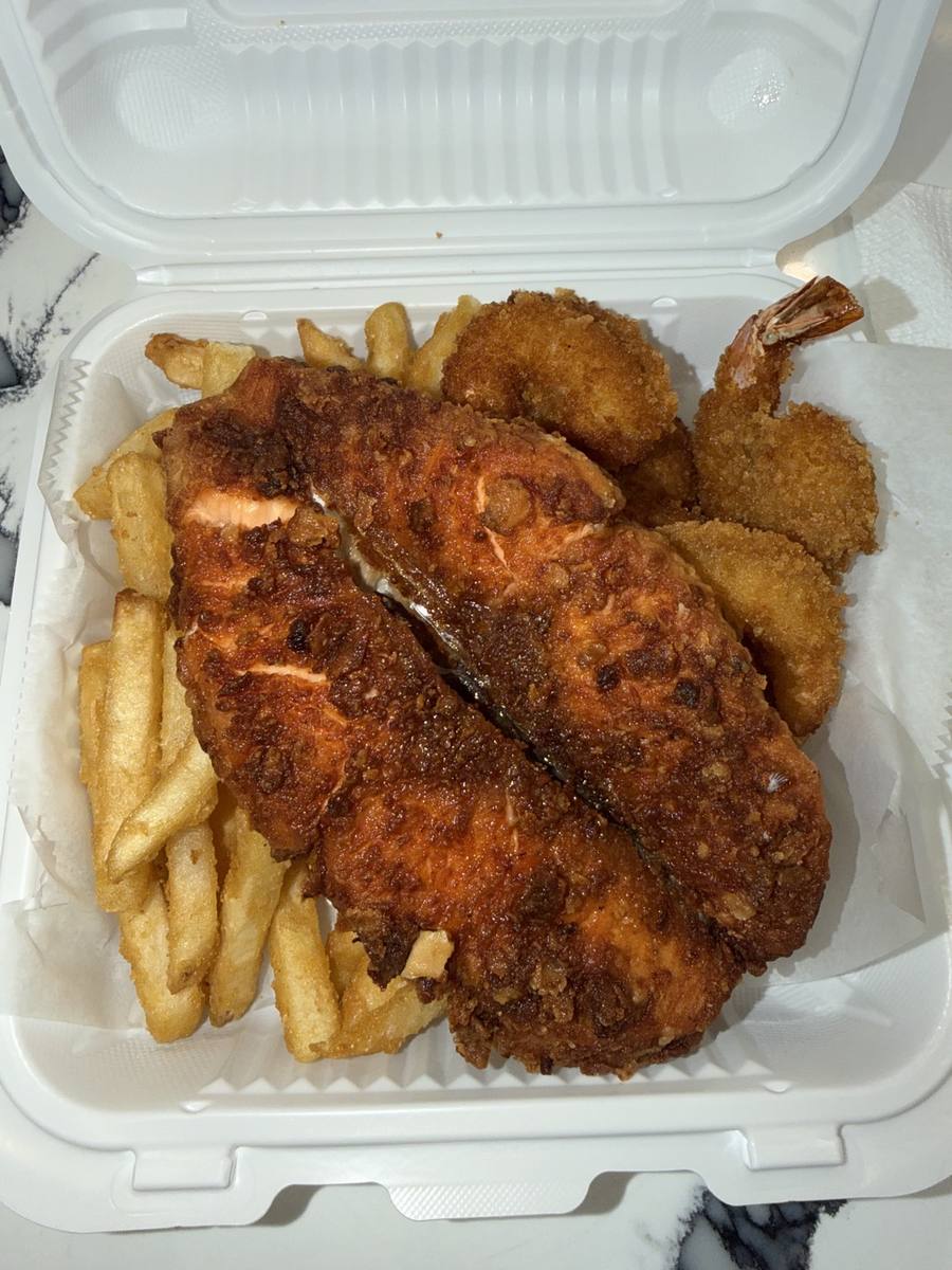 Breaded fish fillet with rice and fries